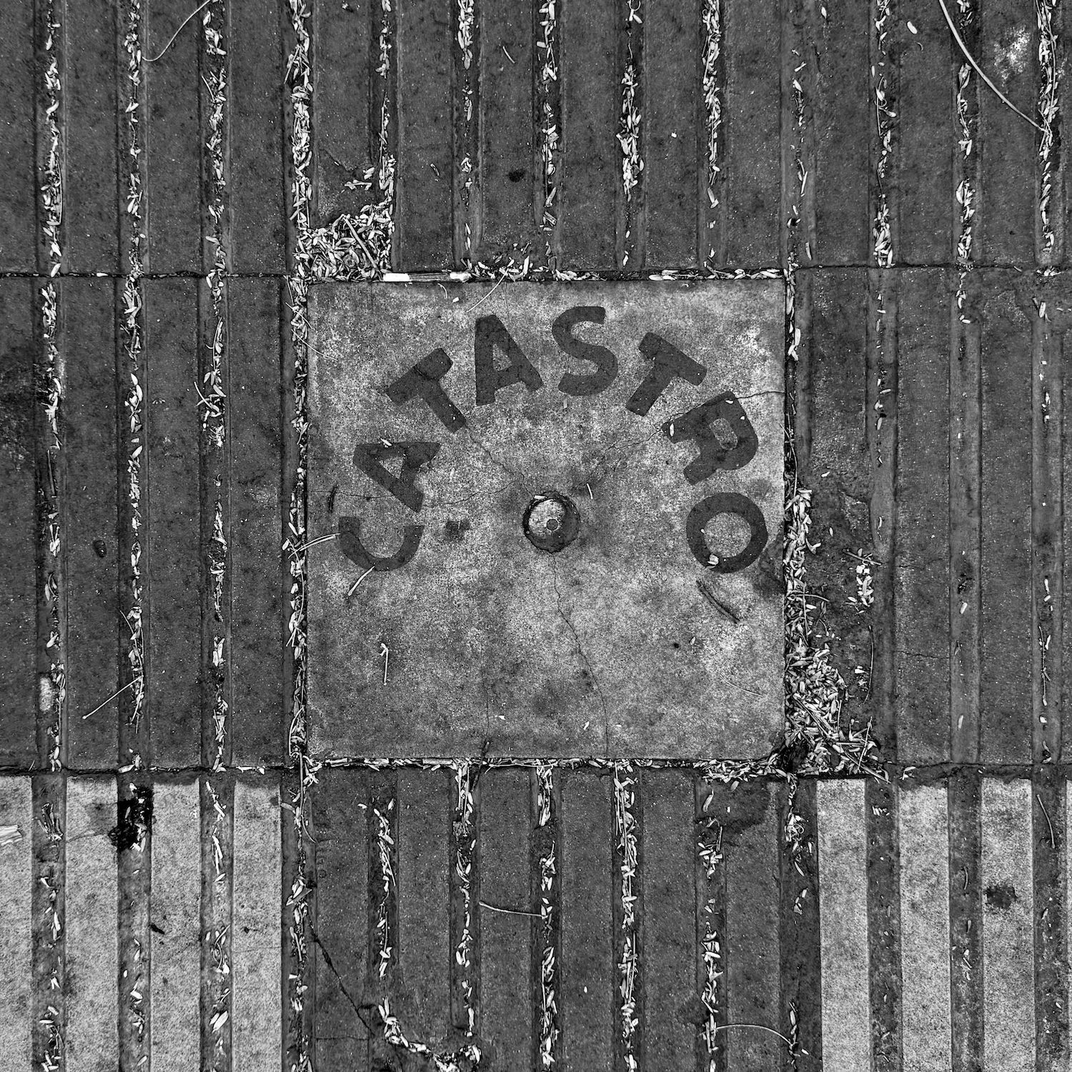 black and white image of a utility cover