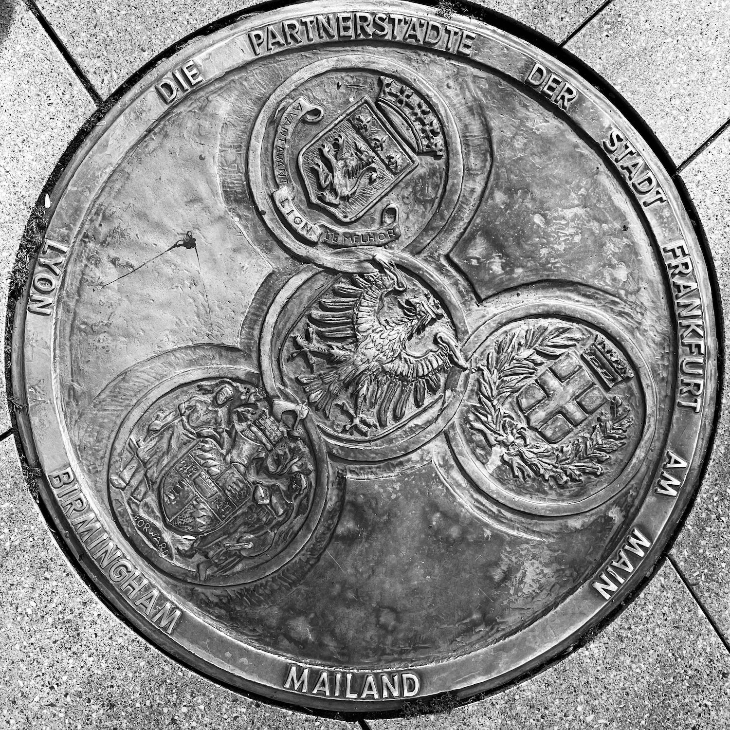 black and white image of a utility cover