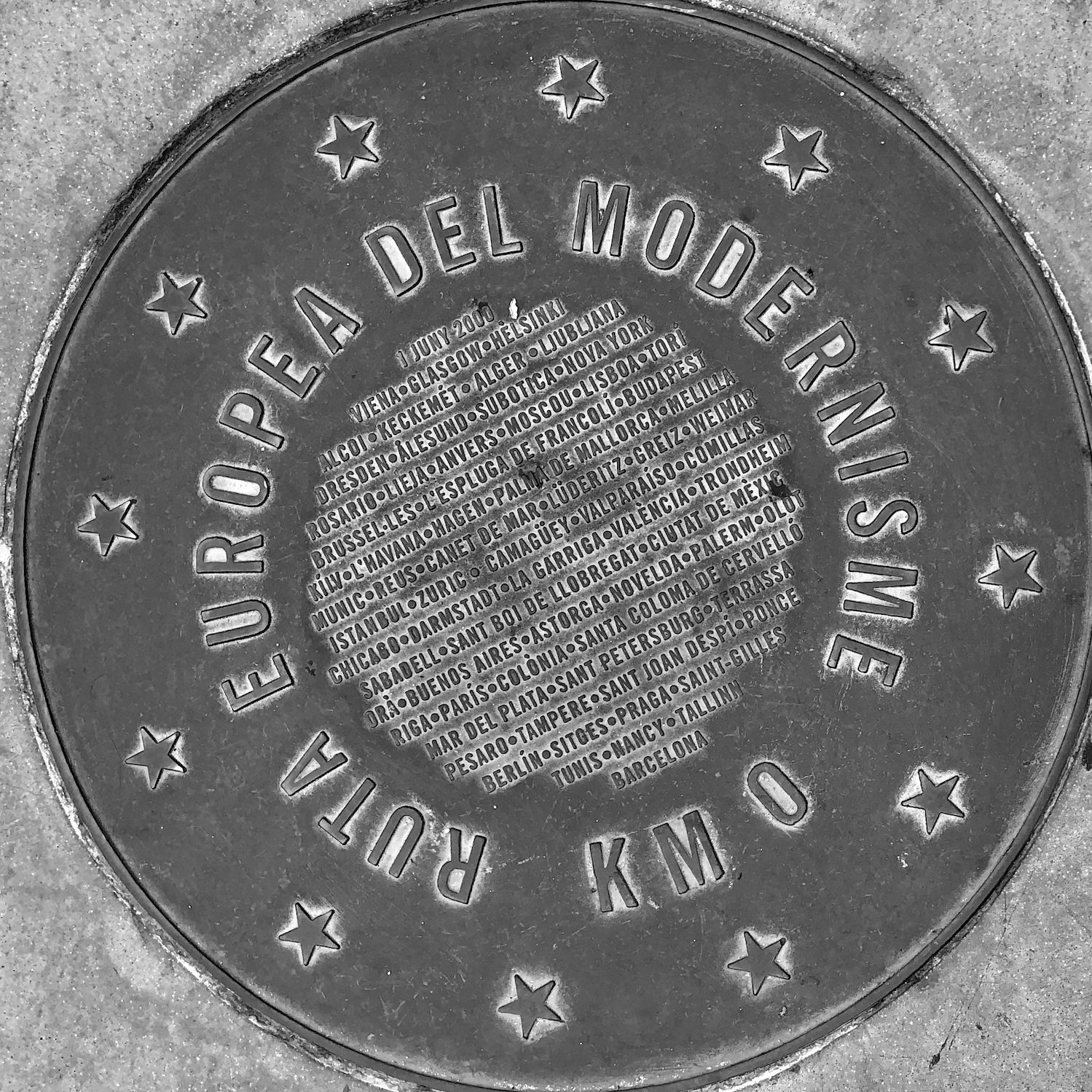 black and white image of a utility cover