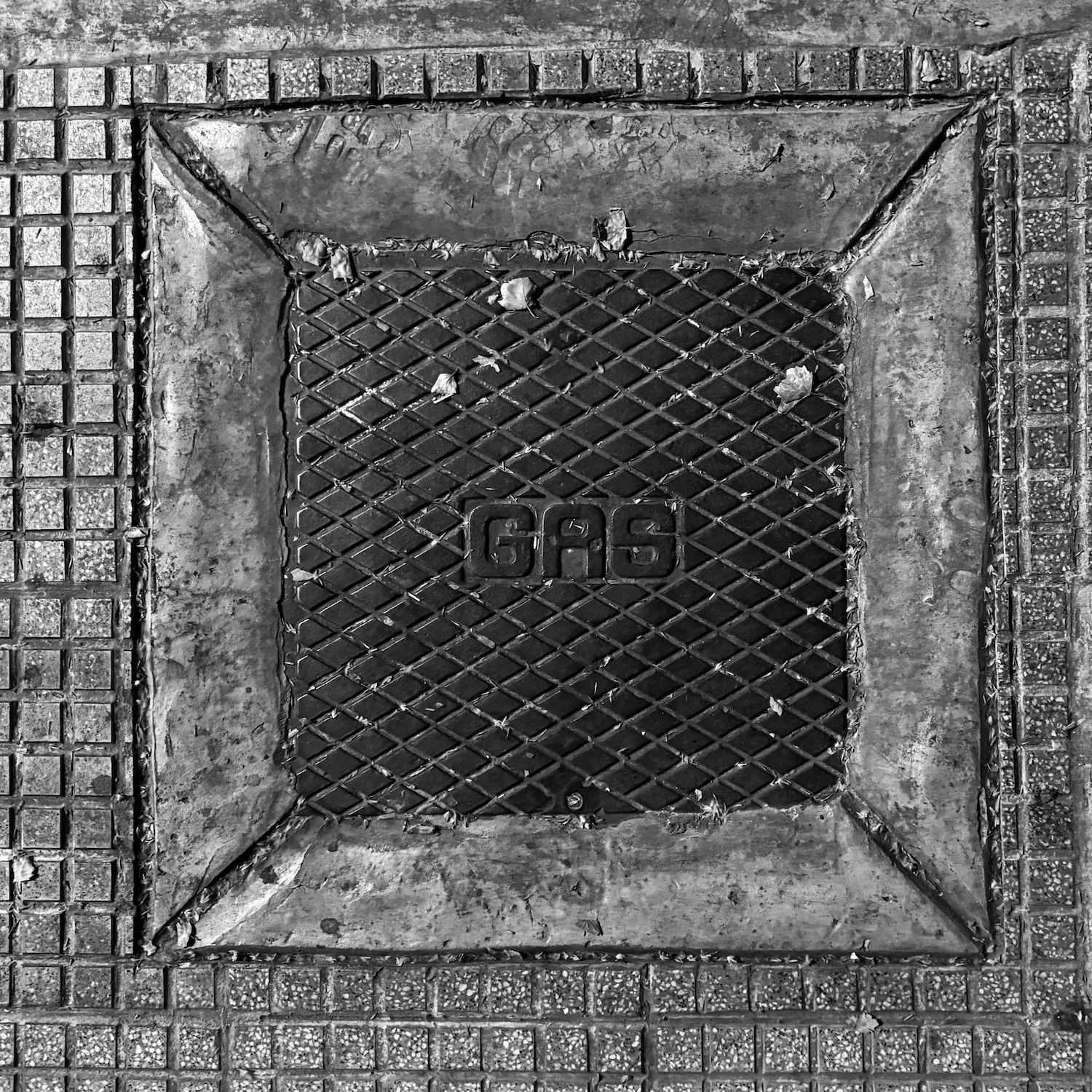 black and white image of a utility cover