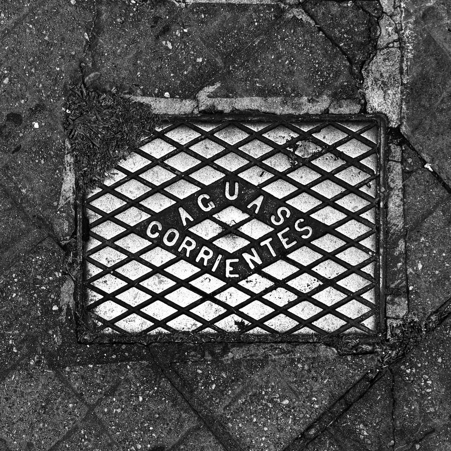 black and white image of a utility cover