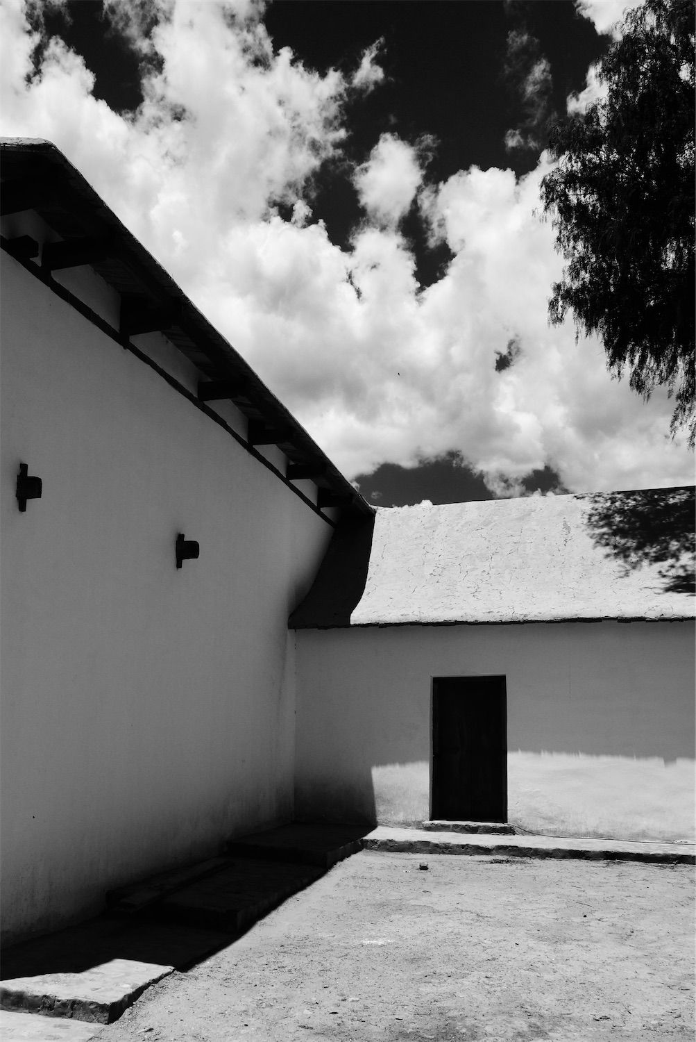 corner of a small church in black and white