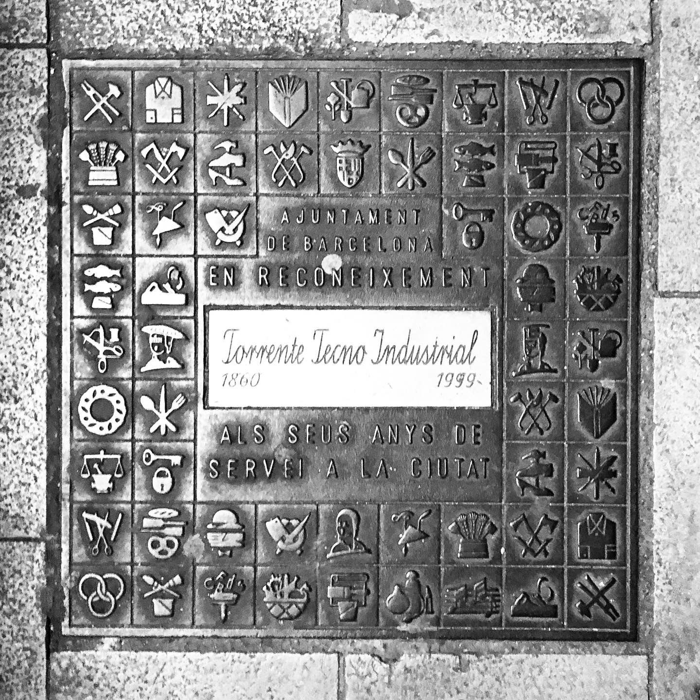 black and white image of a utility cover