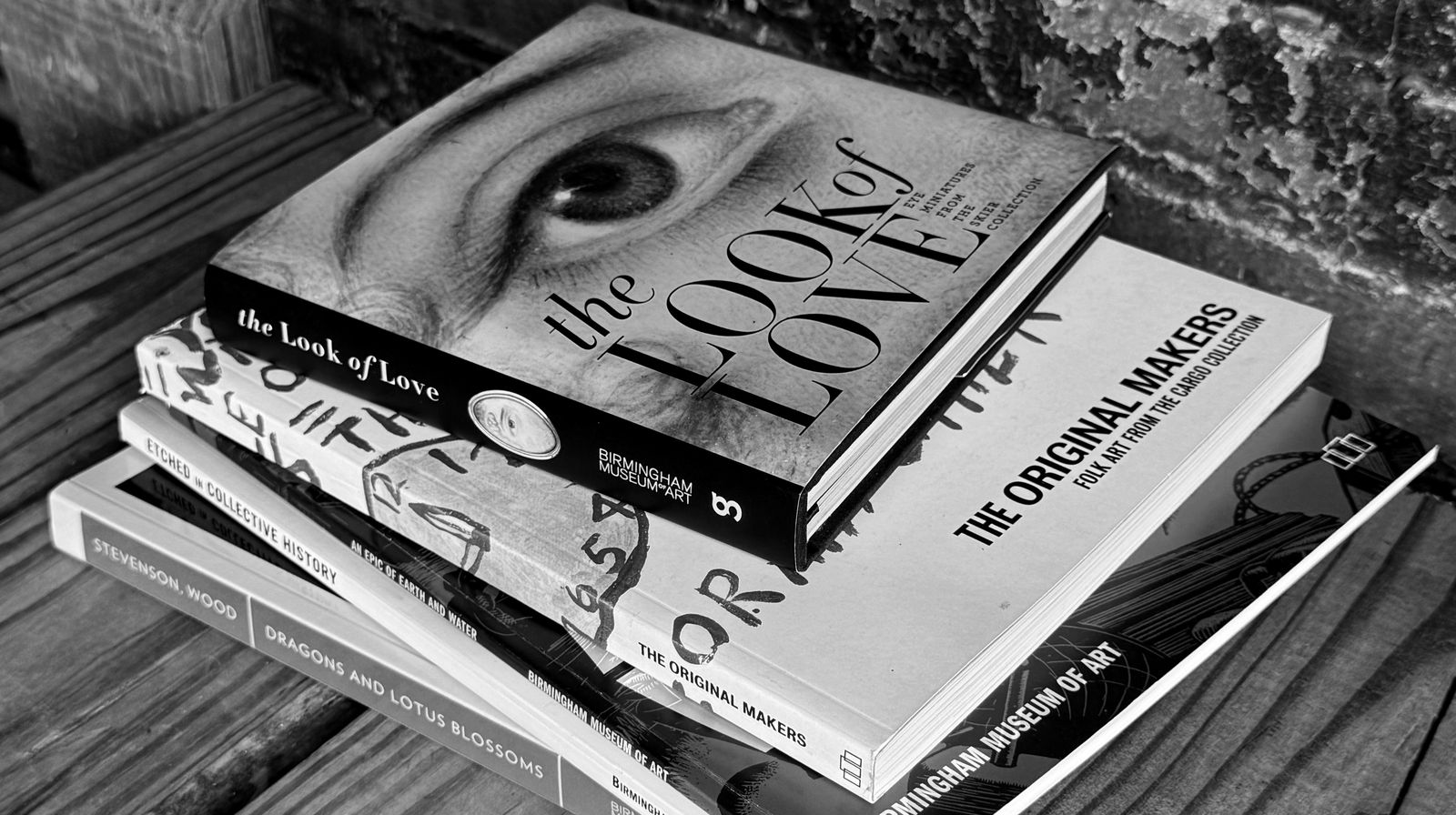 black and white image of a stack of books