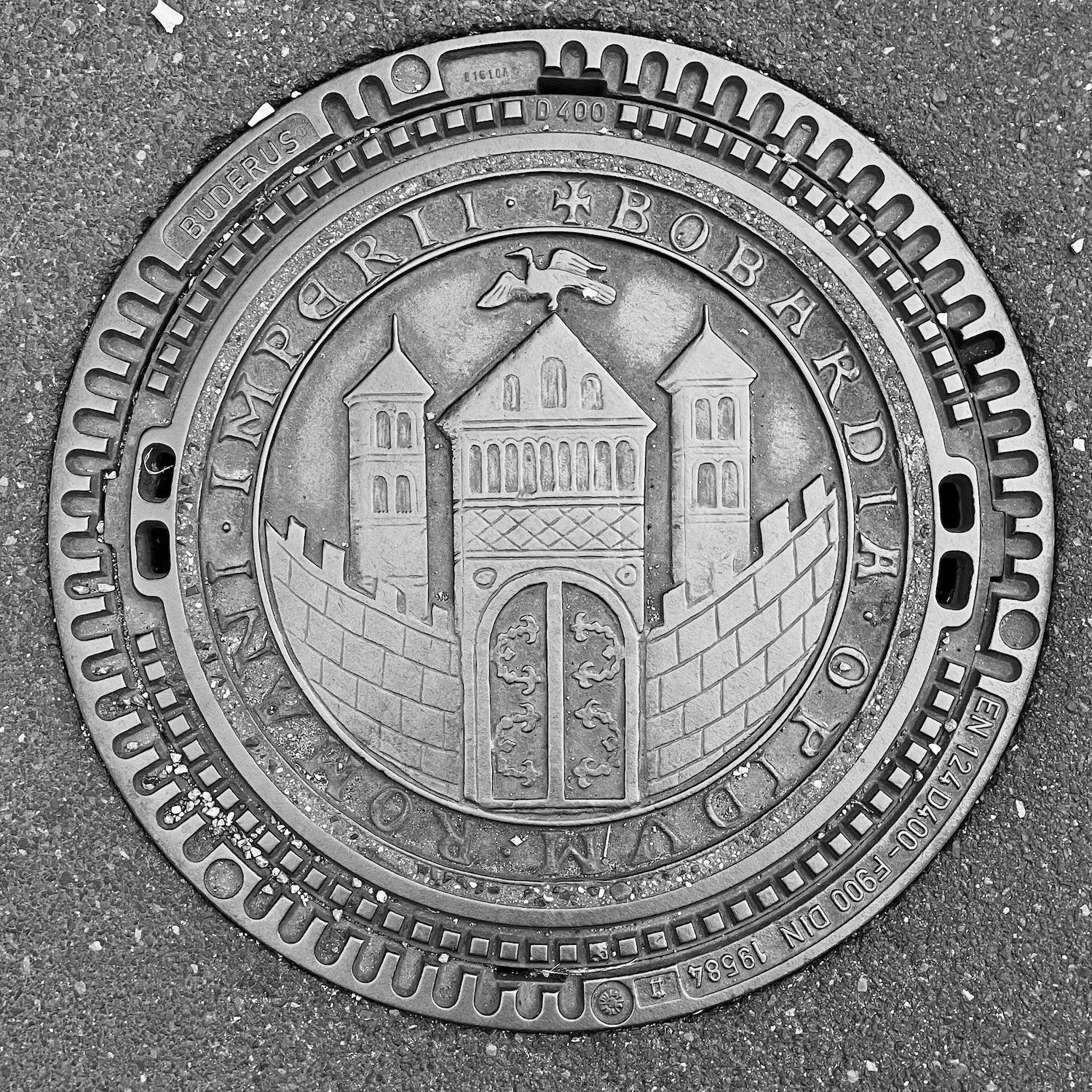 black and white image of a utility cover