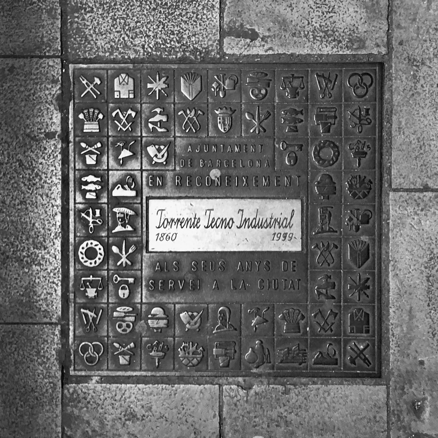 black and white image of a utility cover